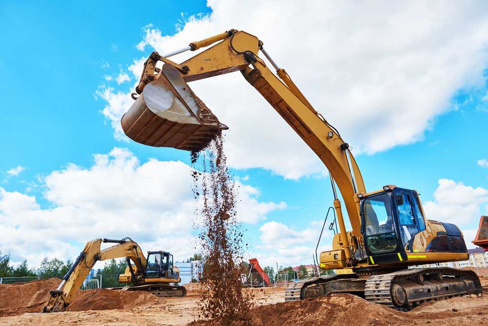 Photo of an excavator at a construction site